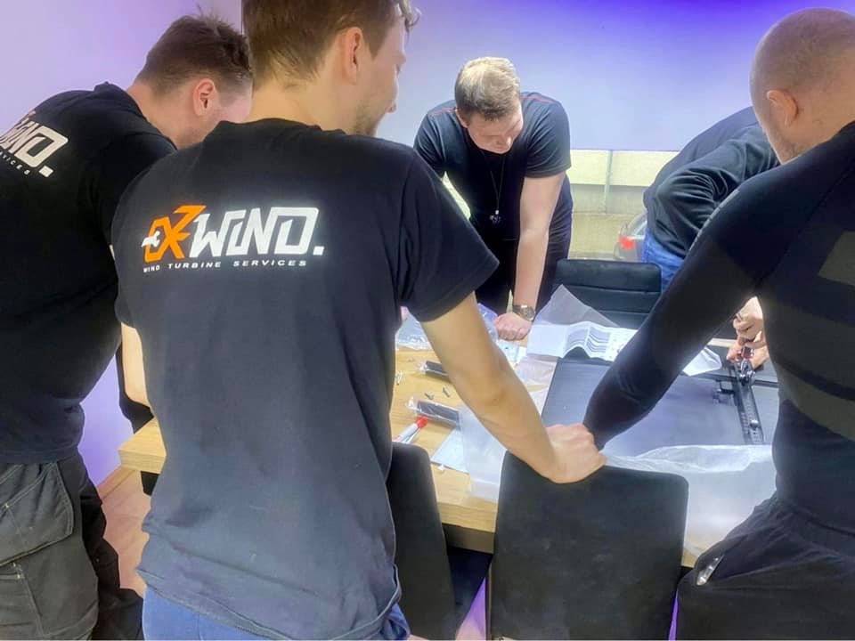 ExWind technicians planning work at a table